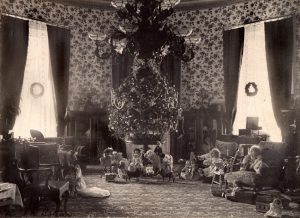 The Cleveland Family tree decorated with red, white and blue electric light bulbs, delighted the president's young daughters. It was placed in the second floor Oval Room of the White House in 1894. 